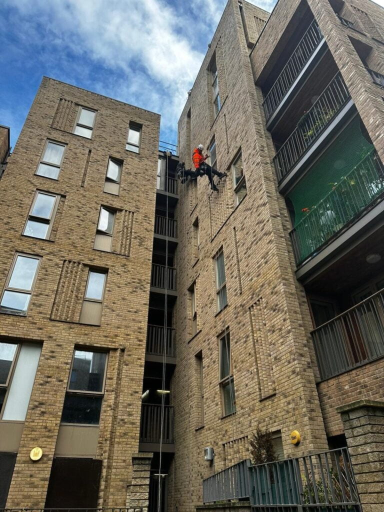 rope access technician completing high rise building inspections and surveys