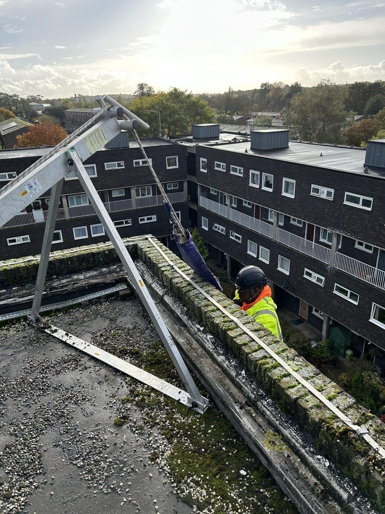 Avisan technician using rope access for gutter cleaning