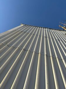 rope access in Essex showing sloping corrugated metal roof