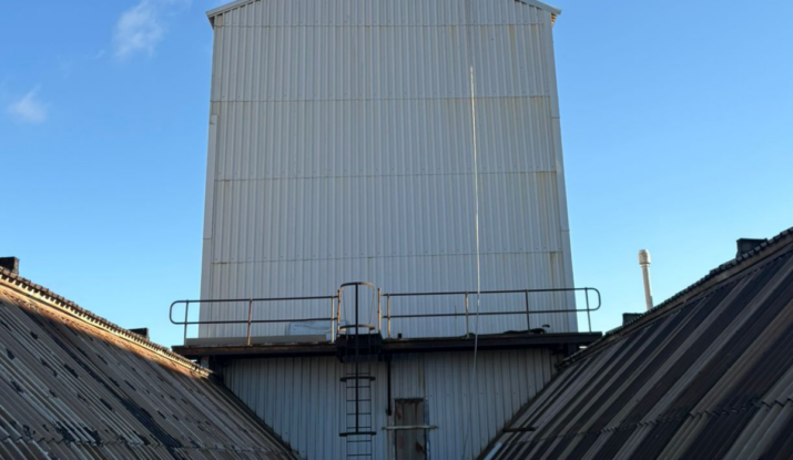 Warehouse rooftop in daylight during rope access in Essex