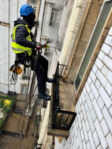 Man on a rope for balcony cleaning London