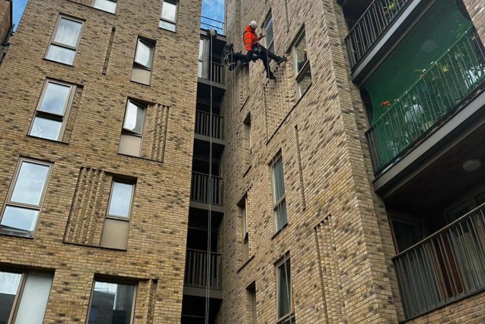 rope access technician completing high rise building inspections and surveys